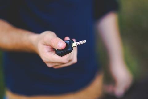 holding a car key
